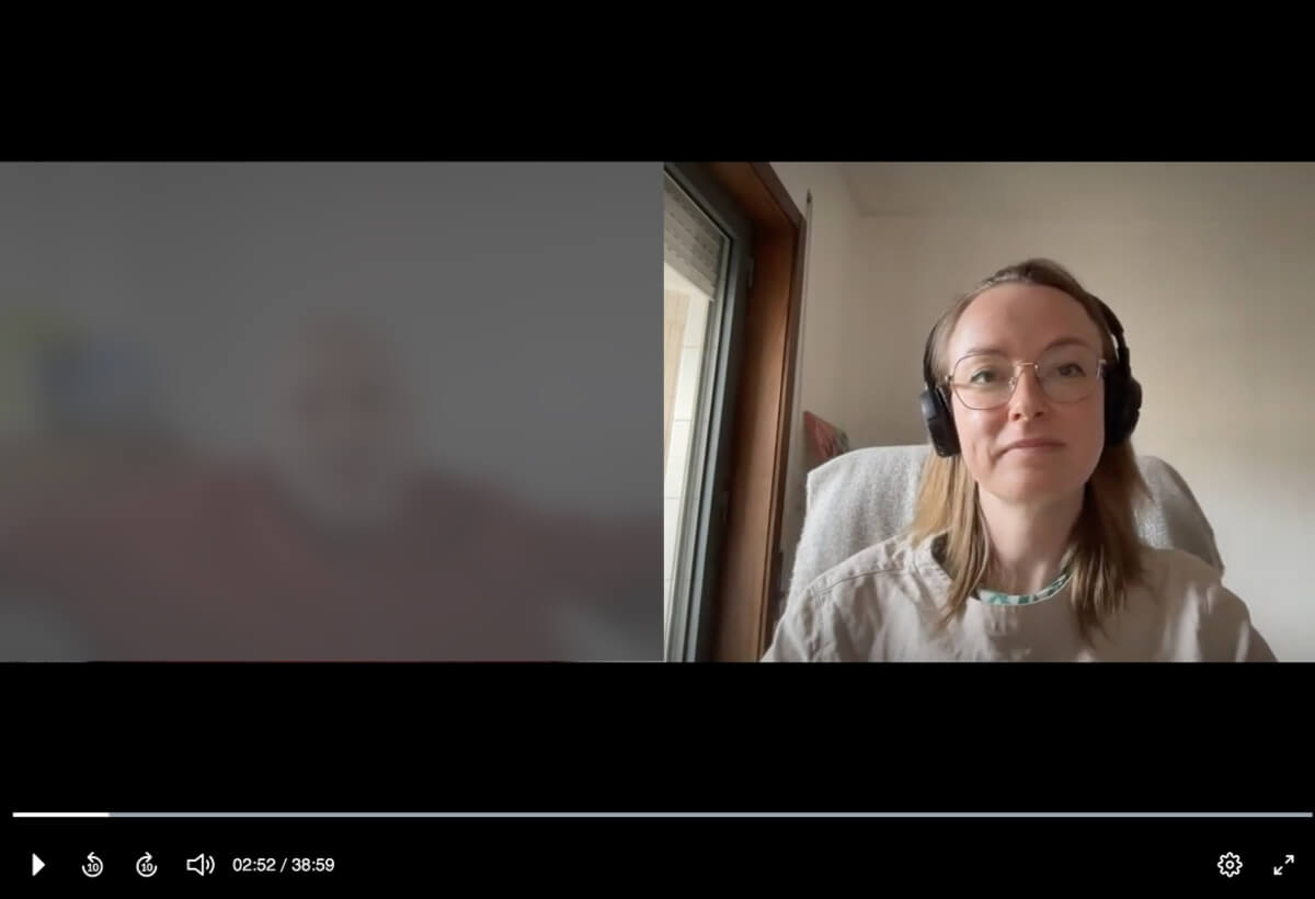 interview The image shows a split screen view with an interviewer on the right hand side and a blurred image of a participant